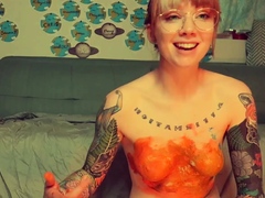 Amateur redhead Jacqueline with glasses masturbates