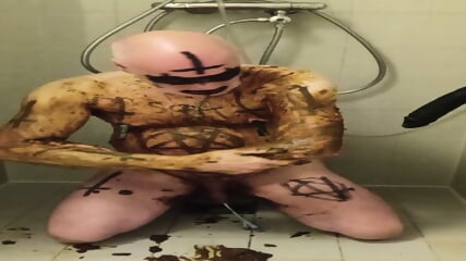 Satan slave does a perverted enema session