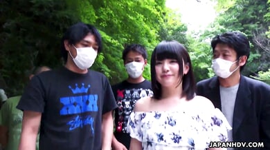 Tsuna Kimura engages in uncensored outdoor group sex with multiple men in a forest setting