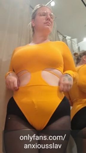 Chubby Girl Trying on Clothes in a Fitting Room