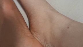 BBW rubs her big feet with oil