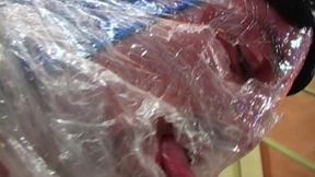 Blonde MILF in Raincoat Sucks Plastic Wrapped Cock