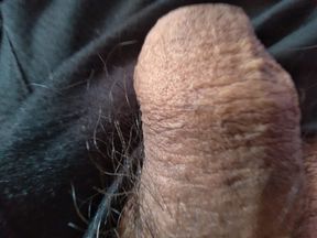 gay man touches his large foreskin for pleasure