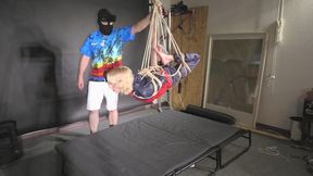Myxxxy bound and suspended in shiny nylon Rainwear