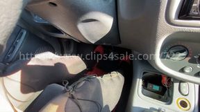 Laetitia revs drives with tights and red pumps - over shoulder pov