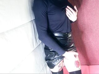 Transsexual solo masturbating in leather petticoat.