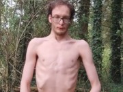 Very skinny lad strips outside in the woods in nature and shows off his body while touching himself