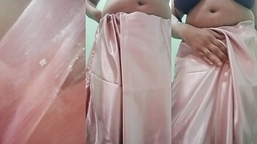 Indian Gay Crossdresser Gaurisissy Pressing and Playing with Her Big Boobs Looking in Pink Saree Looking Like a Housewife