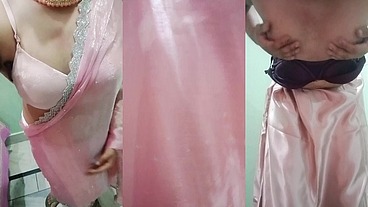 Indian Gay Crossdresser Gaurisissy Pressing and Playing with Her Big Boobs Looking in Pink Saree Looking Like a Housewife