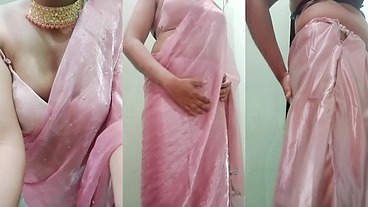 Indian Gay Crossdresser Gaurisissy Pressing and Playing with Her Big Boobs Looking in Pink Saree Looking Like a Housewife