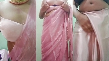 Indian Gay Crossdresser Gaurisissy Pressing and Playing with Her Big Boobs Looking in Pink Saree Looking Like a Housewife