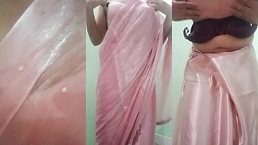 Indian Gay Crossdresser Gaurisissy Pressing and Playing with Her Big Boobs Looking in Pink Saree Looking Like a Housewife