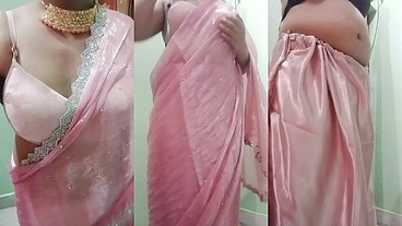 Indian Gay Crossdresser Gaurisissy Pressing and Playing with Her Big Boobs Looking in Pink Saree Looking Like a Housewife