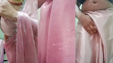 Indian Gay Crossdresser Gaurisissy Pressing and Playing with Her Big Boobs Looking in Pink Saree Looking Like a Housewife