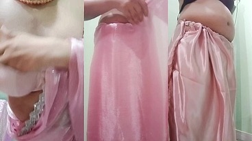Indian Gay Crossdresser Gaurisissy Pressing and Playing with Her Big Boobs Looking in Pink Saree Looking Like a Housewife