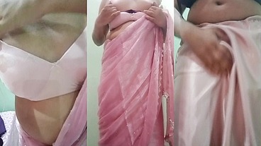 Indian Gay Crossdresser Gaurisissy Pressing and Playing with Her Big Boobs Looking in Pink Saree Looking Like a Housewife