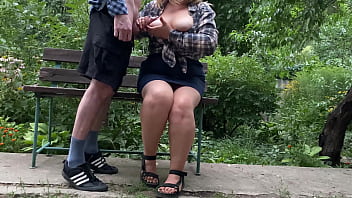 Big cock cumshot on her tits in the park on a bench