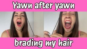 Yawn after yawn while I braid my hair