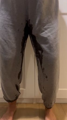 Desperately peeing my sweatpants and making a mess all over the floor