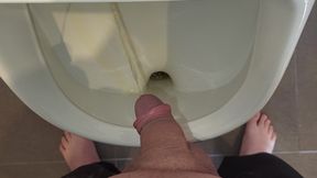 Man peeing in urinal