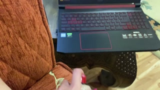 Brunette in a short robe watches porn and masturbates