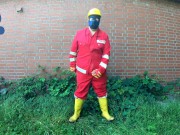 Worker Pup pawing off in red and yellow workgear
