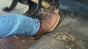 Cowboy boot pumping the gas pedal, cranking it, and revving it up