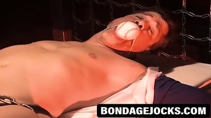 Twink begs for mercy with a ball gag and tight restrictions