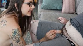 A cheerful girl strips, revealing a tiny cock