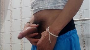 Man with a big cock masturbates in a bathroom