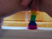 Riding rainbow dildo after shower