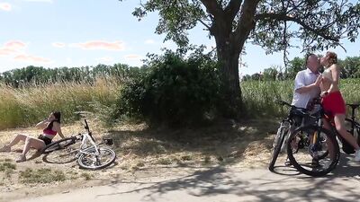 Two slutty girls are fucking with horny old man outside