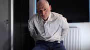 Jonathan sat with his pants down wanking his soft uncut cock getting horny and erection