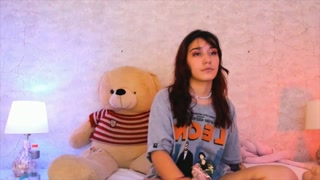 Beautiful redhead college student puts on a very sensual bodysuit that allows you to see her body