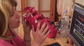 Blonde slut licking her high heels and showing off her tits
