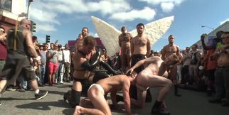 Submissive man lets his masters take advantage of him in public