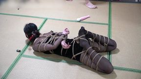 Girlfriend in black sheer stockings, extreme rope bondage, vibrator, gagged with a stocking.