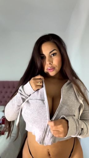 Sexy brunette in a gray hoodie
