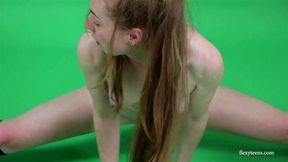 Young brunette gymnast Anna Mostik spreading legs