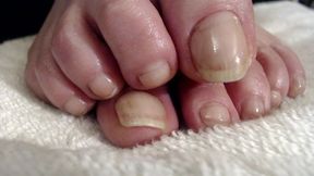 Long natural toenails oiled feet