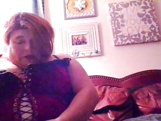 Tgirl big beautiful woman talks about her corset, her pierced nipps, her abdomen, Her femdom-goddess persona.