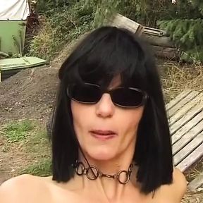 Pretty German babe tied up and fucked in a threesome outdoors