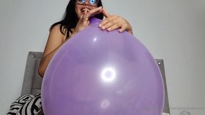 Marianna fills a 16-inch balloon with various balloons