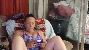 Wet and smoking stepmom plays video games in mini skirt