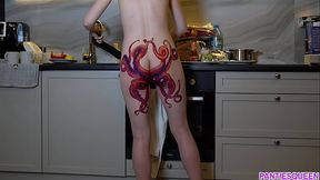 Naked housewife with octopus tattoo on ass cooks dinner on kitchen and ignores you