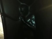 Slave encased in latex vacuum tower