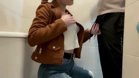 Busty Blonde Sucks Cock in the School Bathroom
