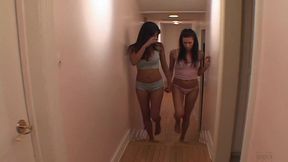 Horny girl bends over as a lesbian lover fucks her with a strap-on dildo