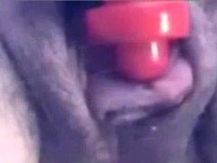 a woman pumps her clit into a dick