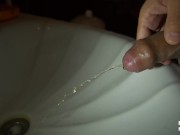 Dick pissing in the sink, slow motion 100fps